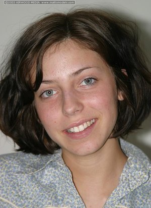 Glasses adorned brunette solo girl Sensual Jane reveals big tits in office